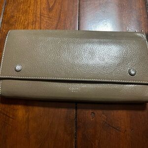 Celine leather wallet in tan with bright yellow interior
